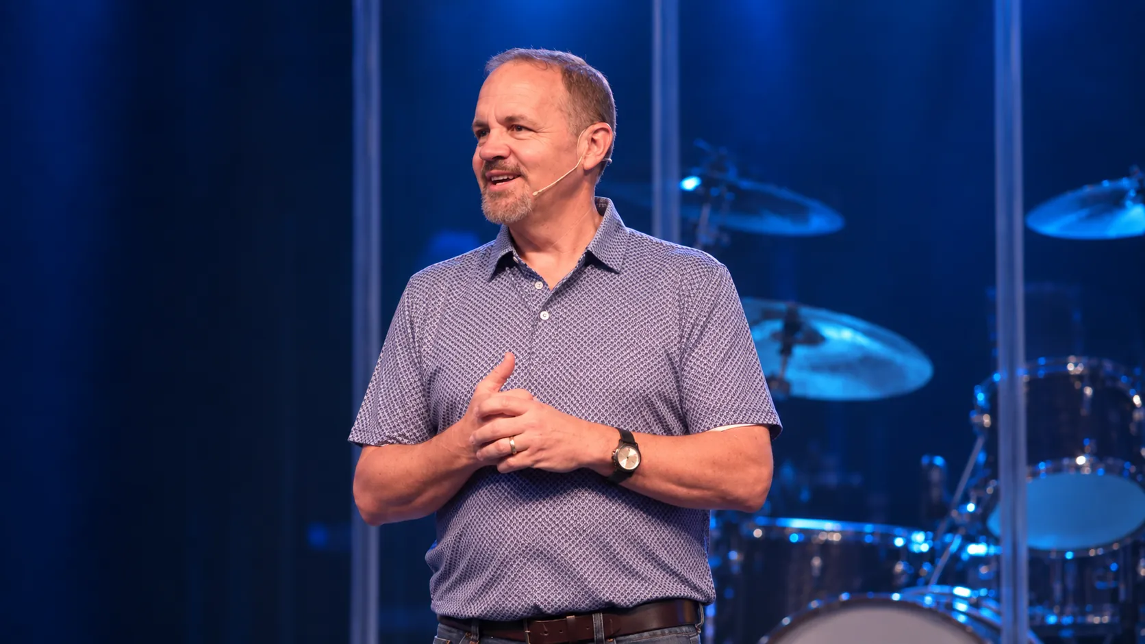 Pastor Clay Monkus speaking on stage at Next Level Church in Matthews, NC
