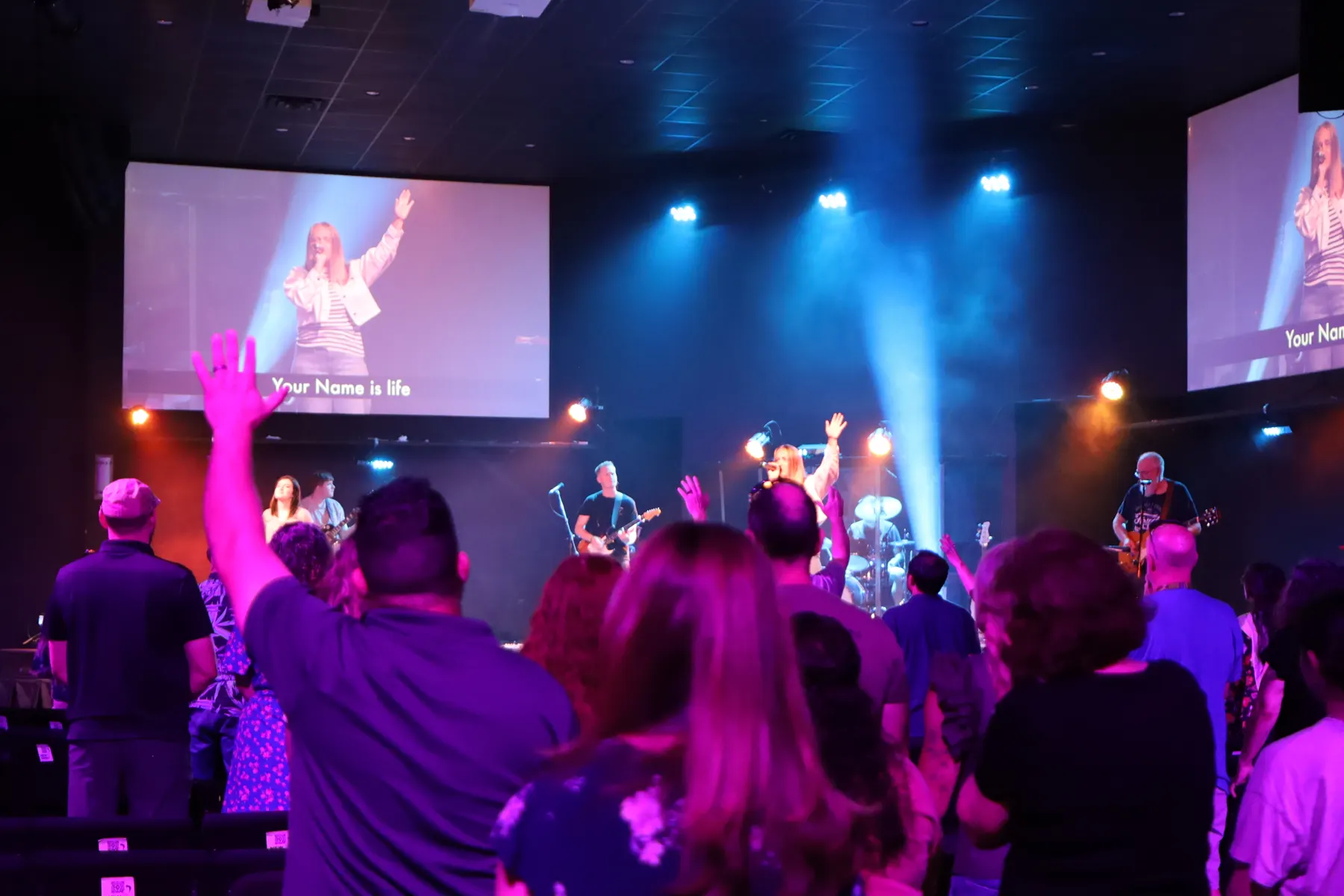 Sunday worship at Next Level Church — the stage, band, and congregation